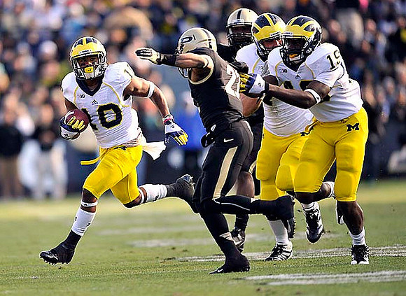 Jeremy Gallon (10), Devin Funchess (19), and Michael Schofield (75)