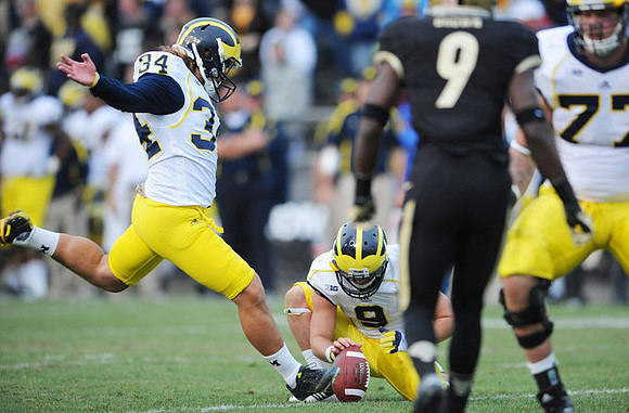 Brendan Gibbons (34), Drew Dileo (9), and Taylor Lewan (77)