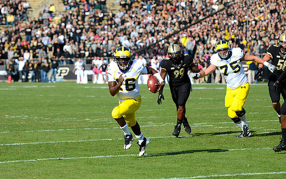 Denard Robinson (16) and Michael Schofield (75)