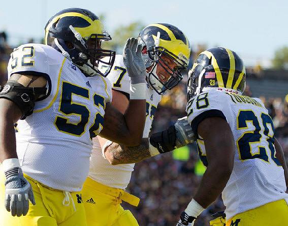 Ricky Barnum (52), Taylor Lewan (77), and Fitzgerald Toussaint (28)