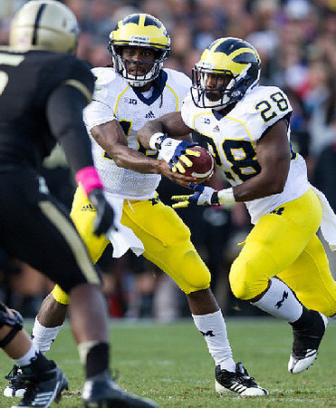 Denard Robinson (16) and Fitzgerald Toussaint (28)