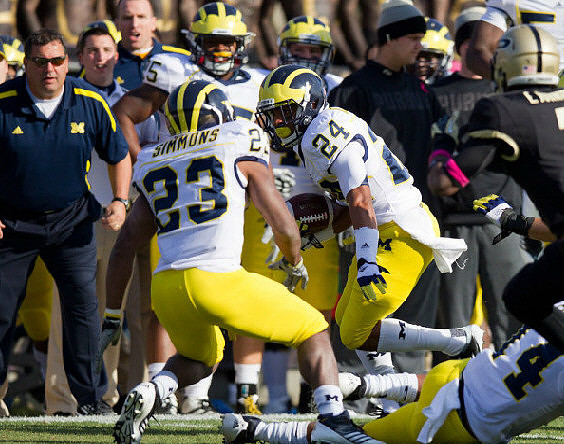Floyd Simmons (23), Delonte Hollowell (24), Josh Furman (14), and Kenny Demens (25)