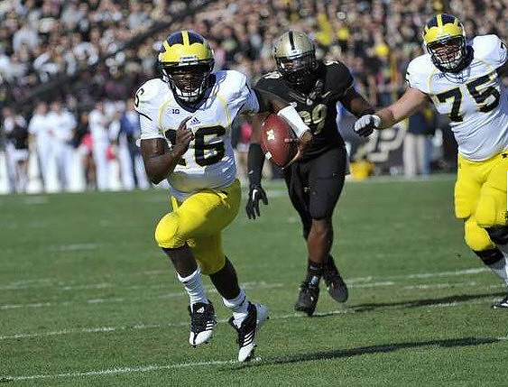 Denard Robinson (16) and Michael Schofield (75)