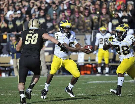 Denard Robinson (16) and Fitzgerald Toussaint (28)