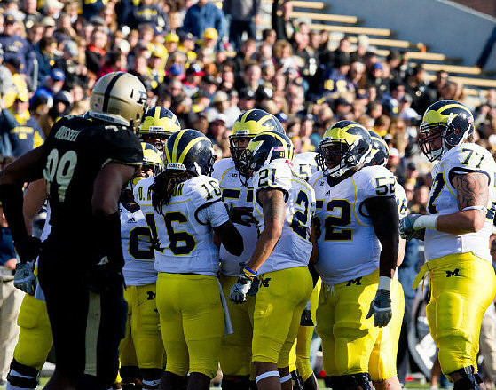 Denard Robinson (16), Roy Roundtree (21), Ricky Barnum (52), and Taylor Lewan (77)