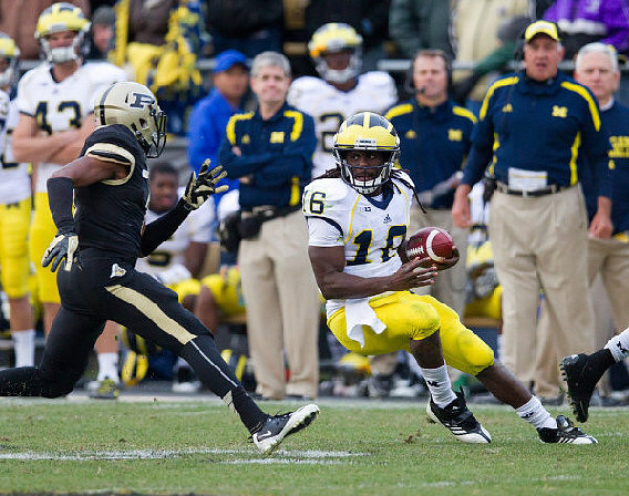 Denard Robinson (16), Will Hagerup (43), and Greg Mattison