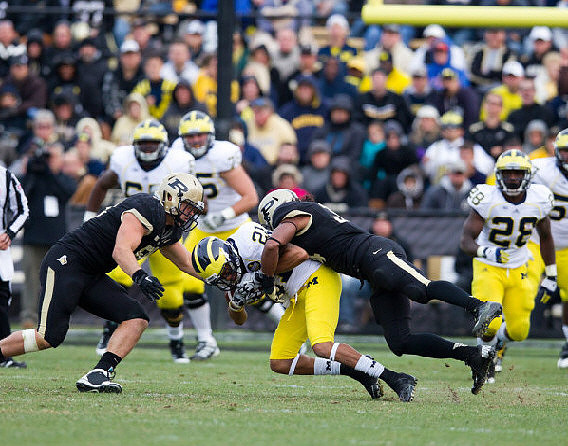 Roy Roundtree (21), Fitzgerald Toussaint (28), Patrick Omameh (65), and Michael Schofield (75)