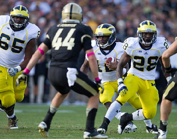 Patrick Omameh (65), Denard Robinson (16), and Fitzgerald Toussaint (28)