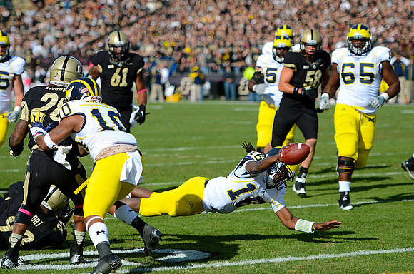 Jeremy Gallon (10), Denard Robinson (16), Ricky Barnum (52), and Patrick Omameh (65)