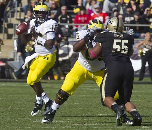 Denard Robinson (16) and Patrick Omameh (65)