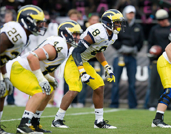 Kenny Demens (25), Desmond Morgan (44), and J.T. Floyd (8)