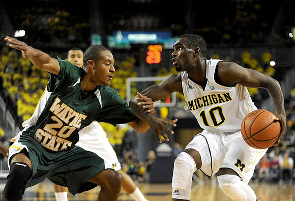 Tim Hardaway Jr. (10) and Jon Horford (15)