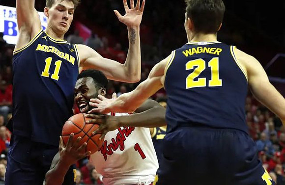 Colin Castleton (11), Franz Wagner (21), and Eli Brooks (55)