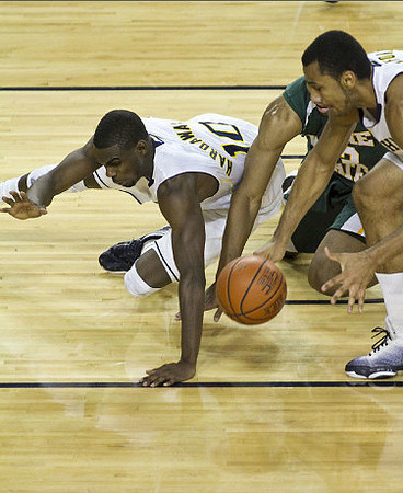 Tim Hardaway Jr. (10) and Jon Horford (15)