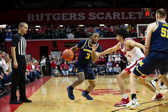 Zavier Simpson (3) and Austin Davis (51)