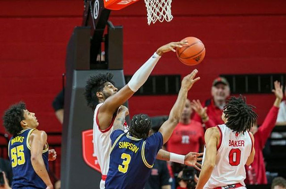 Eli Brooks (55) and Zavier Simpson (3)