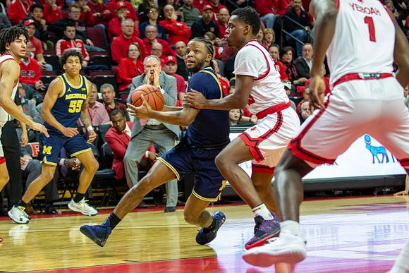Zavier Simpson (3) and Eli Brooks (55)