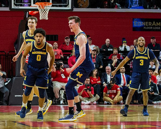 Franz Wagner (21), David DeJulius (0), Colin Castleton (11), and Zavier Simpson (3)