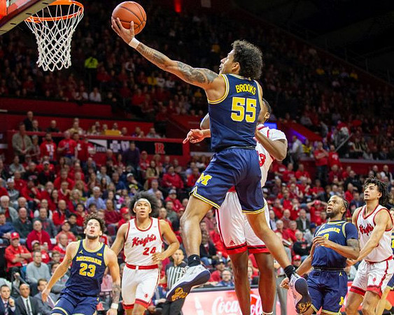 Brandon Johns Jr. (23), Eli Brooks (55), and Zavier Simpson (3)
