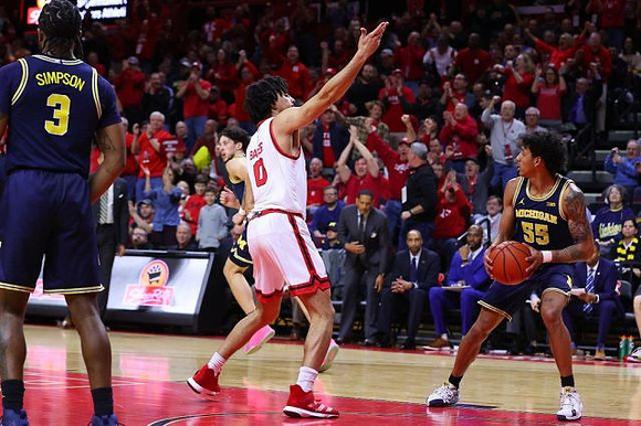Zavier Simpson (3), Brandon Johns Jr. (23), and Eli Brooks (55)