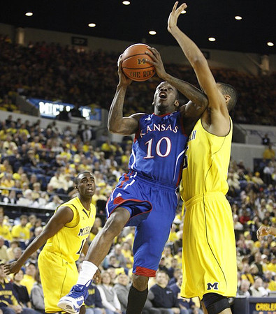 Tim Hardaway Jr. (10) and Jon Horford (15)