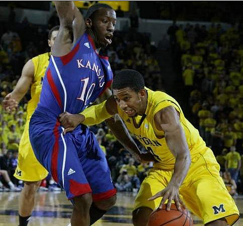 Darius Morris (4) and Jordan Morgan (52)