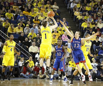 Darius Morris (4), Stu Douglass (1), and Jon Horford (15)