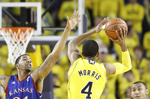 Darius Morris (4) and Jon Horford (15)