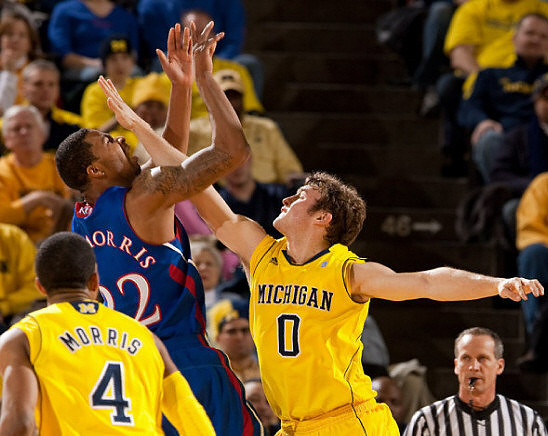Darius Morris (4) and Zack Novak (0)