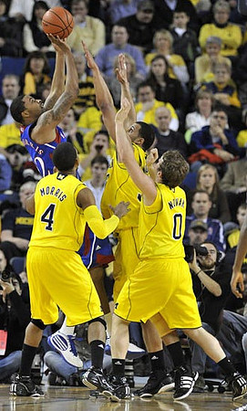Darius Morris (4), Jordan Morgan (52), and Zack Novak (0)