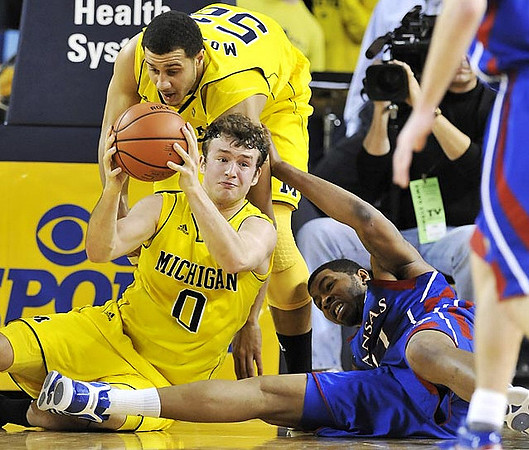 Zack Novak (0) and Jordan Morgan (52)