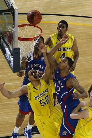 Jordan Morgan (52) and Darius Morris (4)
