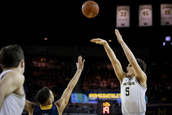 C.J. Baird (24) and Adrien Nunez (5)