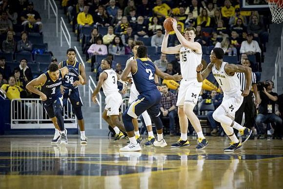 Zavier Simpson (3), Jordan Poole (2), Jon Teske (15), and Charles Matthews (1)