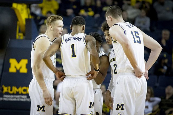 Ignas Brazdeikis (13), Charles Matthews (1), Zavier Simpson (3), Jordan Poole (2), and Jon Teske (15)