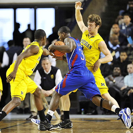 Tim Hardaway Jr. (10) and Zack Novak (0)