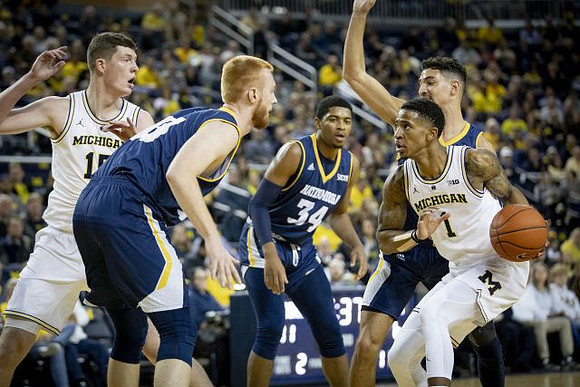 Jon Teske (15) and Charles Matthews (1)