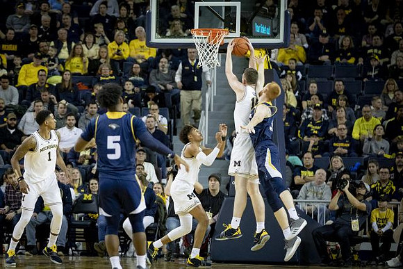 Charles Matthews (1), Jordan Poole (2), and Jon Teske (15)
