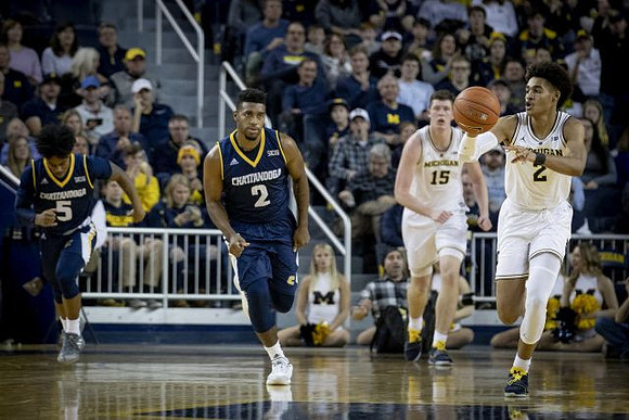 Jon Teske (15) and Jordan Poole (2)