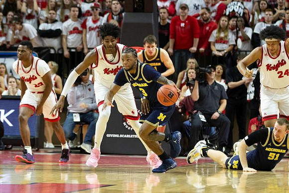 Zavier Simpson (3), Franz Wagner (21), and Austin Davis (51)