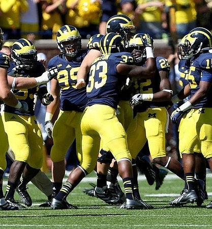 Matthew Godin (99), Taco Charlton (33), Jarrod Wilson (22), and James Ross (15)