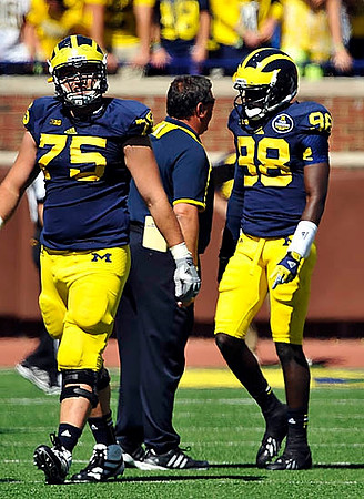Michael Schofield (75), Brady Hoke, and Devin Gardner (98)