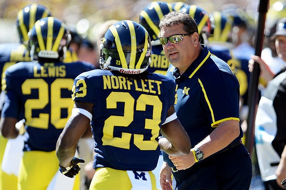 Jourdan Lewis (26), Dennis Norfleet (23), and Brady Hoke