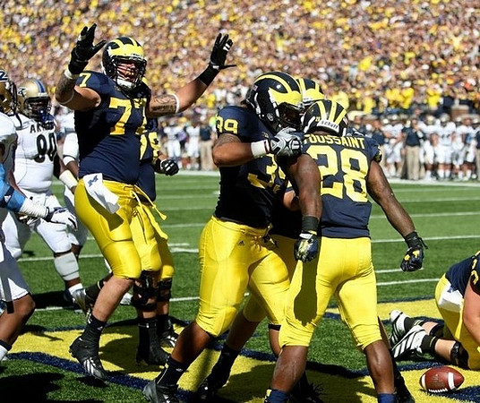 Taylor Lewan (77), Sione Houma (39), and Fitzgerald Toussaint (28)