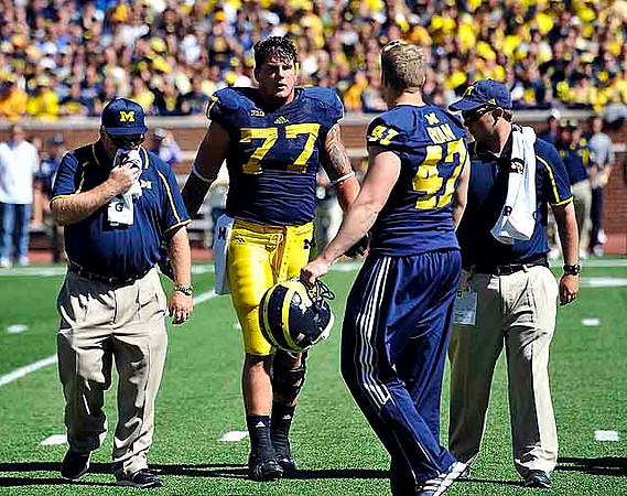 Taylor Lewan (77) and Jake Ryan (47)