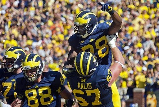 Michael Schofield (75), Jake Butt (88), Kyle Kalis (67), and Fitzgerald Toussaint (28)