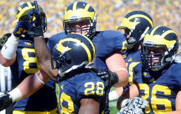 Jake Butt (88), Fitzgerald Toussaint (28), Kyle Kalis (67),  and Joe Kerridge (36)