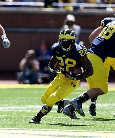 Fitzgerald Toussaint (28), Jake Butt (88), and Jack Miller (60)