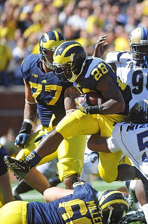 Taylor Lewan (77), Jack Miller (60), and Fitzgerald Toussaint (28)