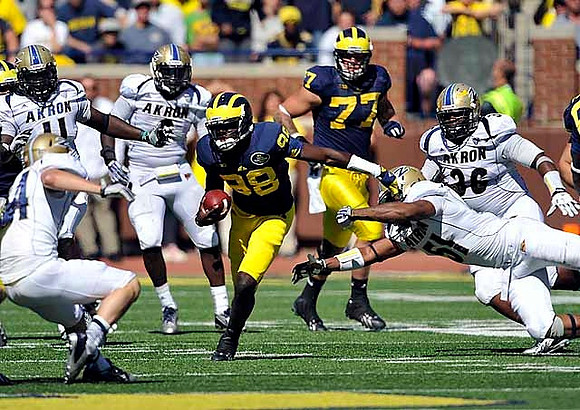 Fitzgerald Toussaint (28) and Taylor Lewan (77)